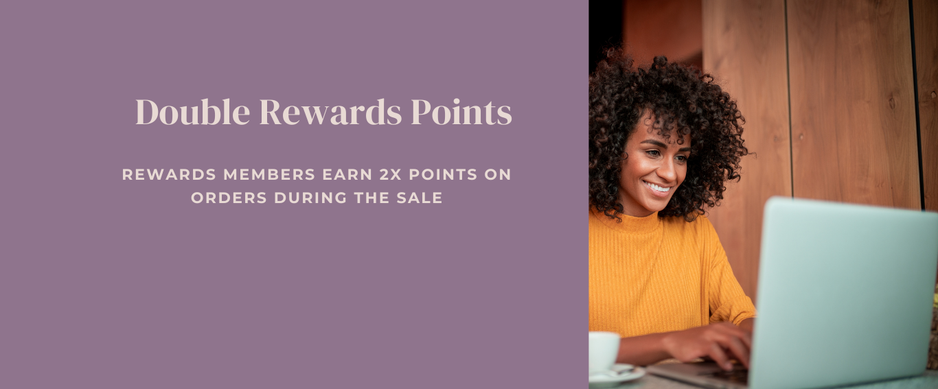 Woman using a laptop with promotional text about double rewards points on a purple background